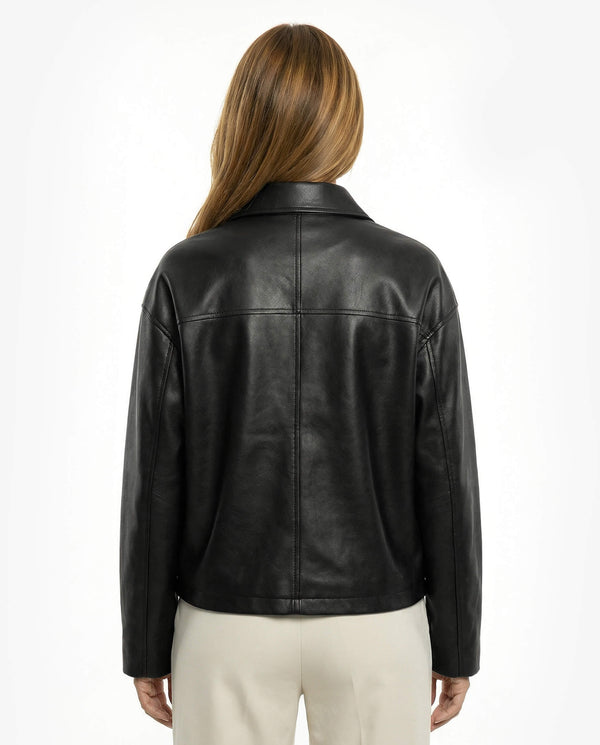 Black leather jacket worn by a person on a white backgroundBlack leather jacket on a white background - sfosh