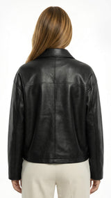 Black leather jacket worn by a person on a white backgroundBlack leather jacket on a white background - sfosh