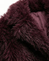 Close-up of dark purple fluffy fabric texture - sfosh