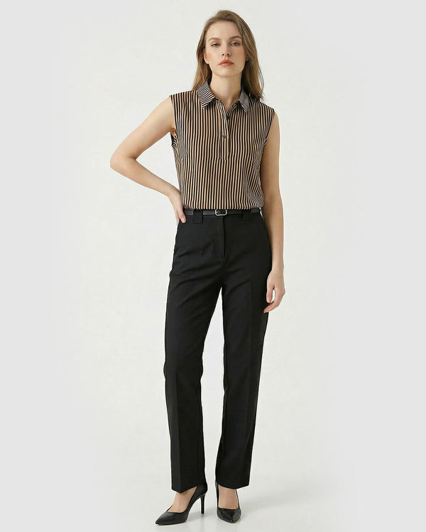 Woman wearing a sleeveless striped shirt and black pants on a white background- sfosh