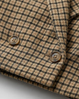 Close-up of a checkered coat with buttons on a white background - sfosh